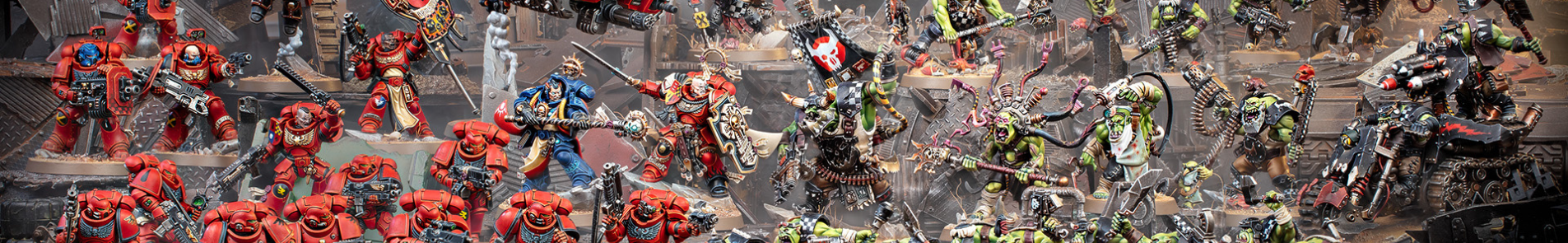 Two armies of Warhammer 40,000 miniatures face off in the battle for Armageddon: Blood Angels Space Marines vs. Orks